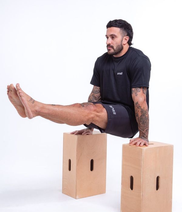 Athletic man performing strength exercise for better lifestyle balance